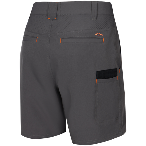 Lake Shore Performance Short featuring water-repellent fabric, laser-punched yoke, zippered cargo pocket, and reinforced plier’s pocket, ideal for active outdoor pursuits.