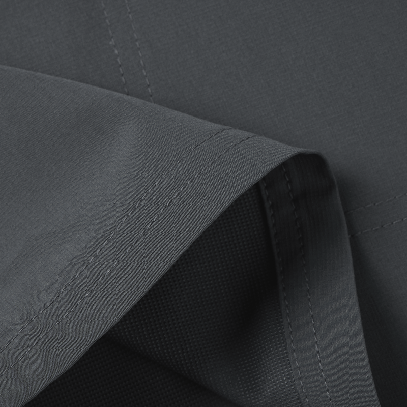 Close-up of Lake Shore Performance Short fabric, highlighting its durable and breathable design, ideal for active outdoor activities, featuring technical water-repellent and stretch properties.