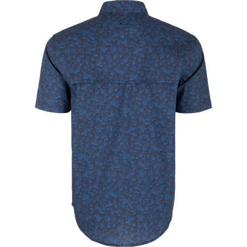 Cotton Marsh Print Short Sleeve Shirt with bird and plant pattern, featuring button-down collar, flap pockets, and sculpted hem, ideal for versatile, active wear.