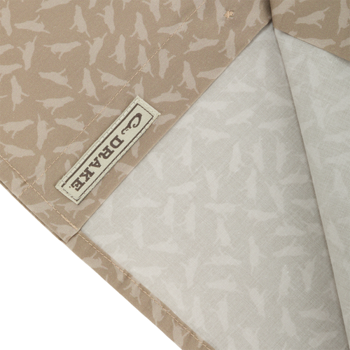 Close-up of Cotton Lab Print Short Sleeve Shirt, showcasing the soft cotton blend poplin fabric with a label detail, highlighting its lightweight and versatile design.