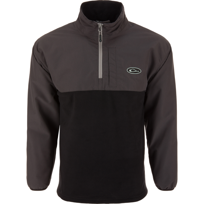 Eqwader Half Zip Pullover with waterproof upper shell, breathable black fleece body, and chest zip pocket, designed for enhanced comfort and protection in waterfowl hunting.