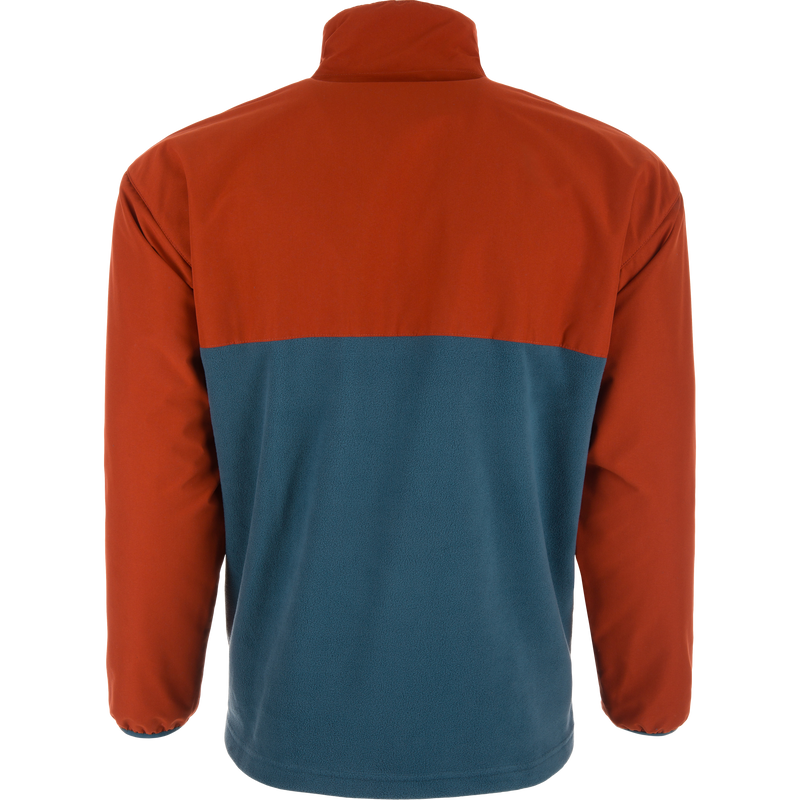 Eqwader Half Zip Pullover displayed from the back, featuring a rust-orange upper and teal-blue lower, with waterproof upper shell and breathable lower shell on a mannequin.