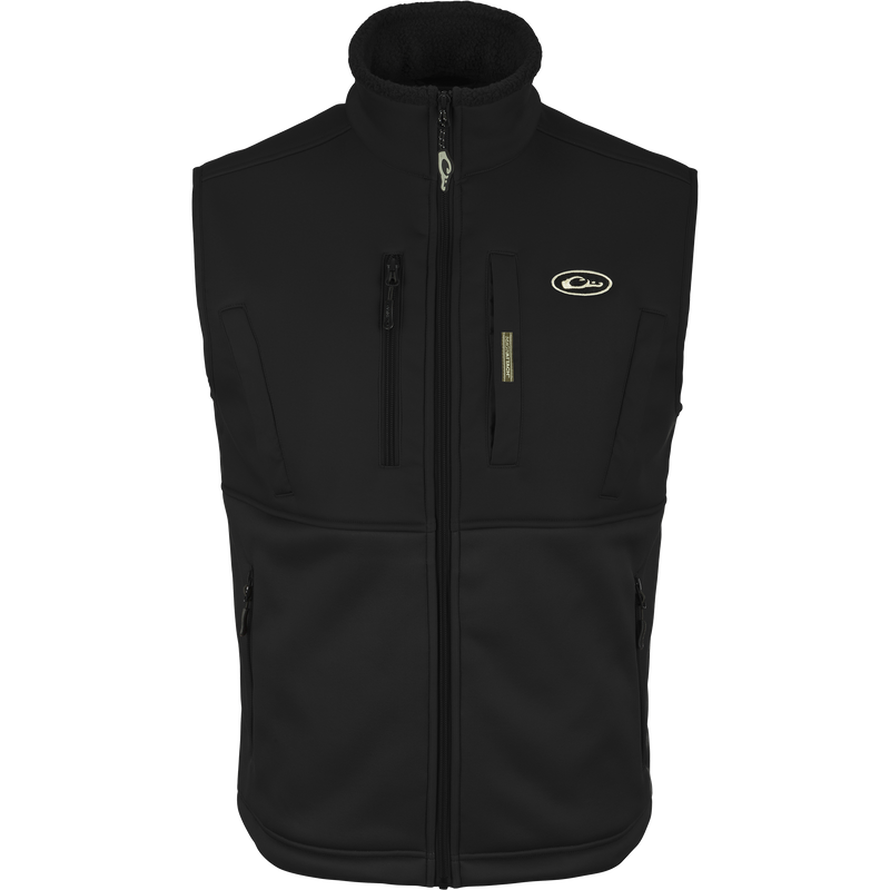 Hole Shot Solid Vest with zippered pockets, windproof upper body, and sherpa-lined lower body for warmth, featuring adjustable drawcord waist and high handwarmer pockets.
