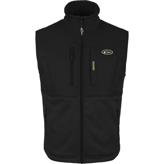 Hole Shot Solid Vest with zippered pockets, windproof upper body, and sherpa-lined lower body for warmth, featuring adjustable drawcord waist and high handwarmer pockets.