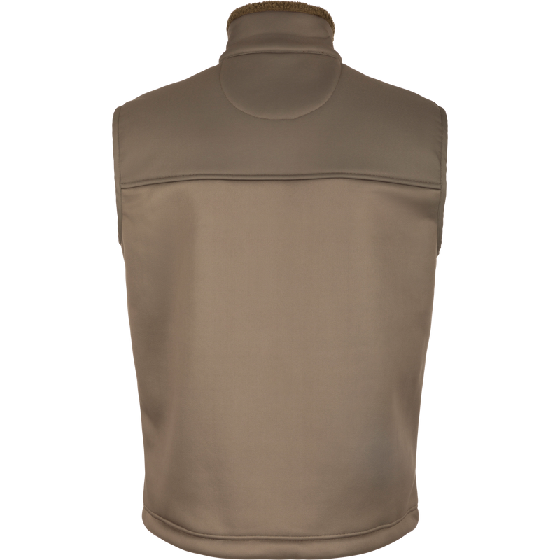 Close-up of the Hole Shot Solid Vest, showcasing its windproof design, sherpa lining, high handwarmer pockets, and adjustable drawcord waist.