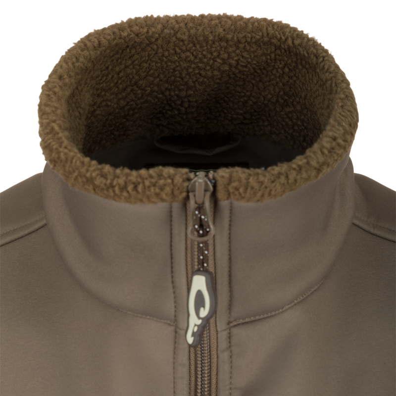 Close-up of the Hole Shot Solid Vest, highlighting the zipper, high handwarmer pockets, and adjustable waist for windproof and warm functionality.