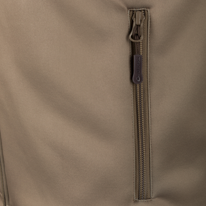 Close-up of the YKK zipper on the Hole Shot Solid Vest, highlighting its durable construction and functional design for cold weather.