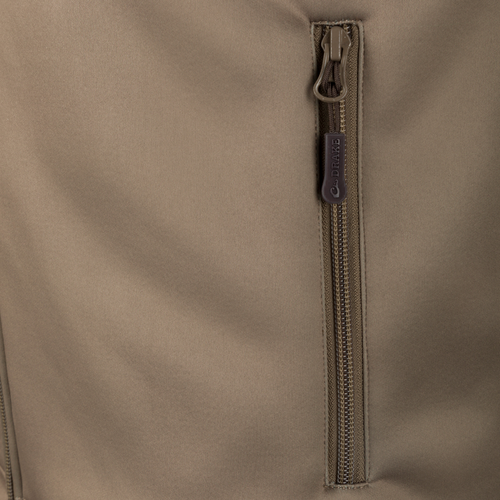 Close-up of the YKK zipper on the Hole Shot Solid Vest, highlighting its durable construction and functional design for cold weather.