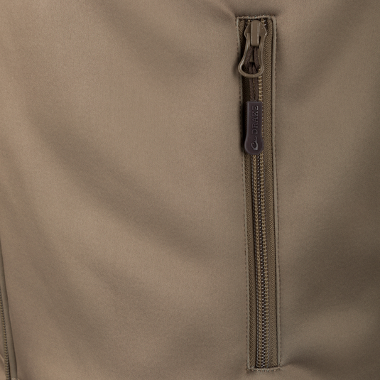 Close-up of the YKK zipper on the Hole Shot Solid Vest, highlighting its durable construction and functional design for cold weather.