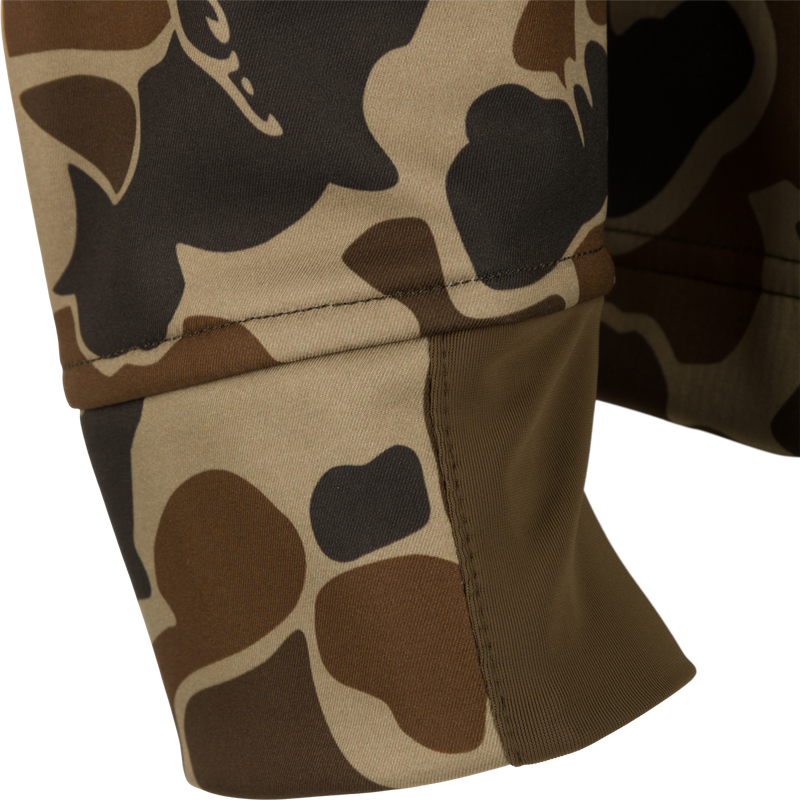Camo Windproof Softshell Jacket, featuring a close-up of the camouflage fabric with visible stitching, showcasing its windproof and water-resistant design.