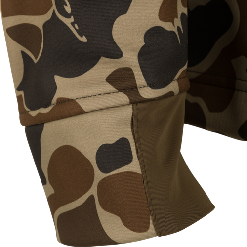Camo Windproof Softshell Jacket, featuring a close-up of the camouflage fabric with visible stitching, showcasing its windproof and water-resistant design.