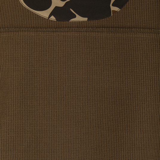 Camo Windproof Softshell Jacket with chest and slash pockets, stretch cuffs, and drawcord waist; designed for wind and water resistance.