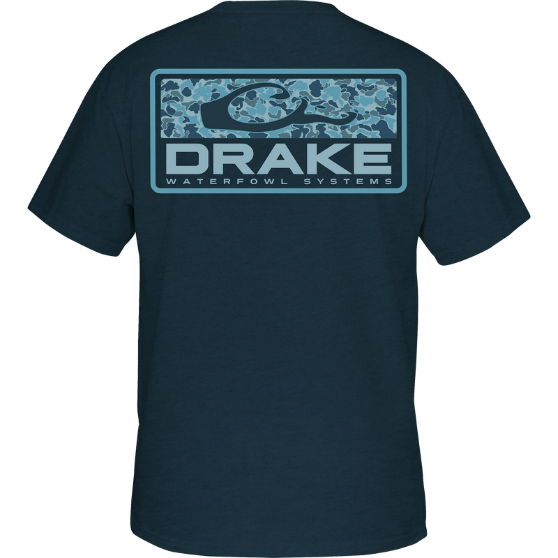 Back of the Old School Bar T-Shirt featuring a blue camo logo panel with “DRAKE” and “WATERFOWL SYSTEMS”; front chest pocket includes Drake logo.
