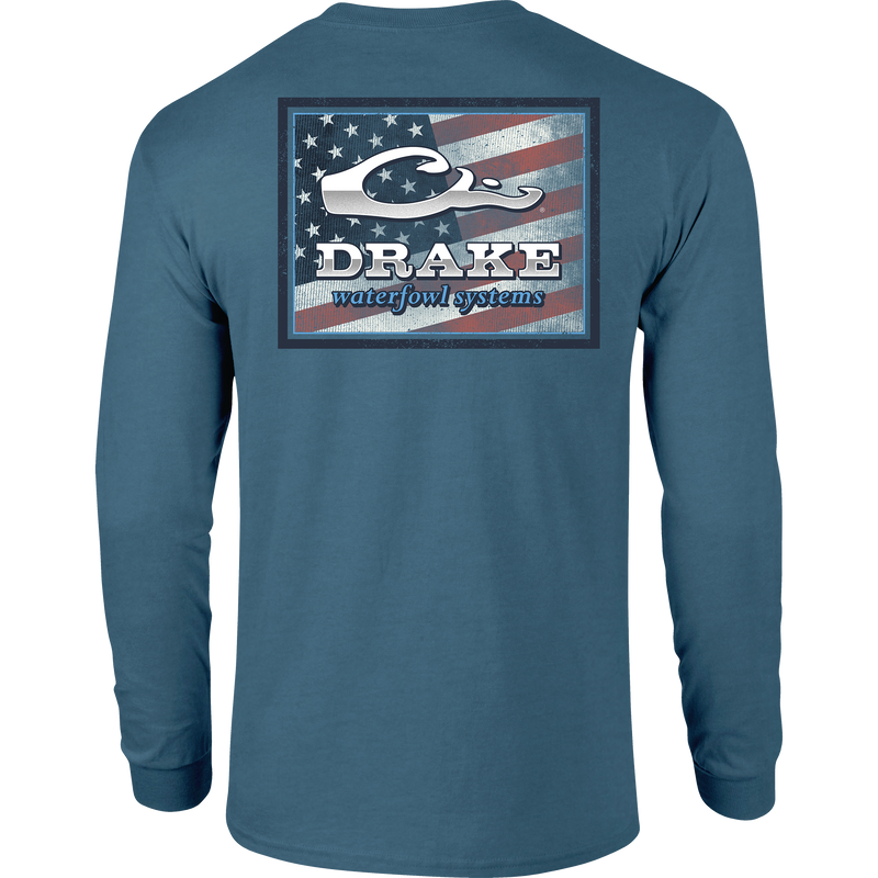 A Flag Square Long Sleeve T-Shirt featuring a Drake logo pocket and an American Flag graphic from the Americana Drake Series. Made of 60% cotton and 40% polyester blend for comfort. By Purewhitelaneshop.