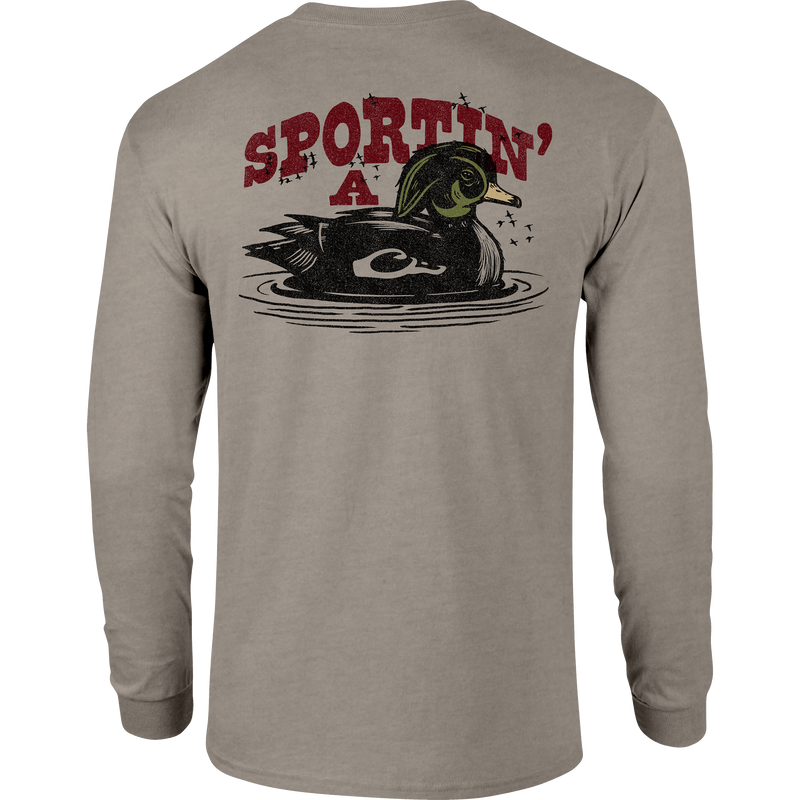 Sportin A Woodie Long Sleeve T-Shirt featuring front pocket Drake logo and back graphic, crafted from a soft 60% cotton, 40% polyester blend.