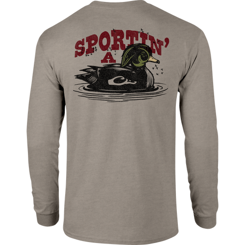 Sportin A Woodie Long Sleeve T-Shirt featuring front pocket Drake logo and back graphic, crafted from a soft 60% cotton, 40% polyester blend.