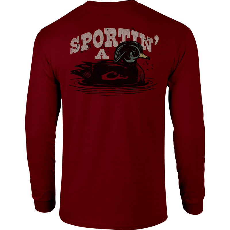 Sportin A Woodie Long Sleeve T-Shirt with front pocket Drake logo and back graphic, crafted from a soft cotton-polyester blend for comfort.
