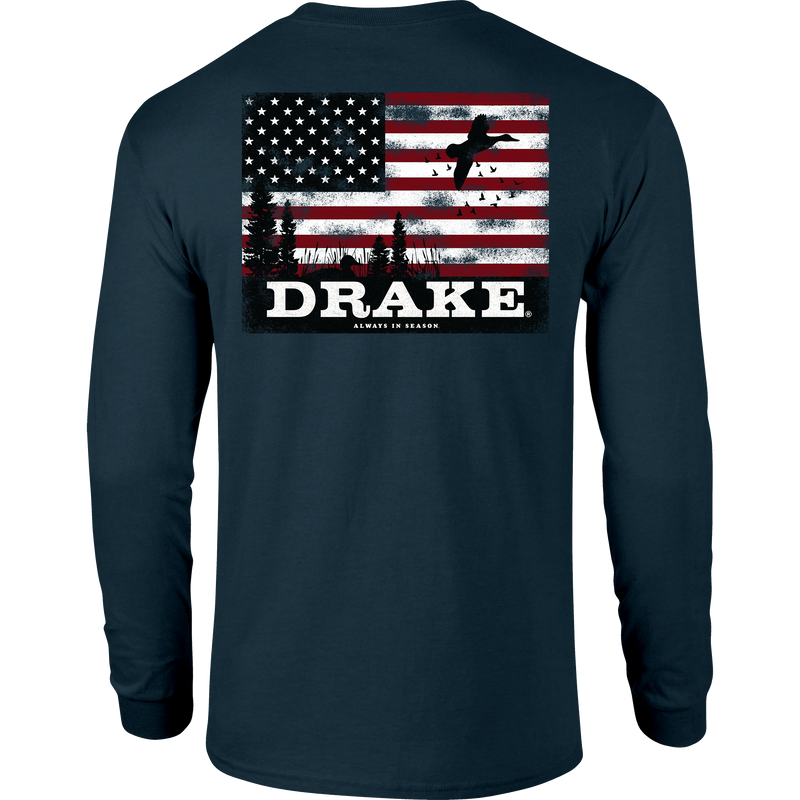 Americana Scenic Long Sleeve T-Shirt features a distressed American-flag design with pine trees and duck silhouettes, plus DRAKE and Always in Season slogan on the back.