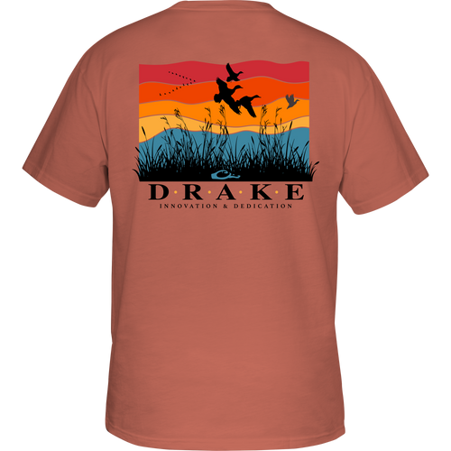Flyway Sunrise Cotton T-Shirt featuring a graphic of birds flying over grass, part of Drake's Heritage Cotton Series, known for its soft, garment-washed comfort.