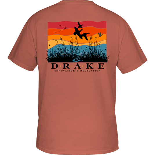 Flyway Sunrise Cotton T-Shirt featuring a graphic of birds flying over grass, part of Drake's Heritage Cotton Series, known for its soft, garment-washed comfort.