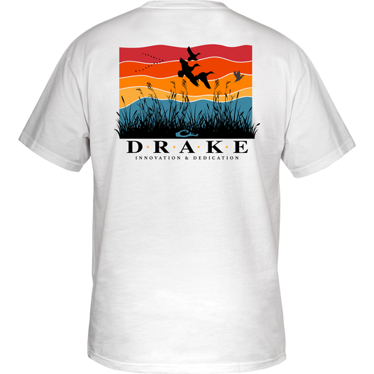 Flyway Sunrise Cotton T-Shirt featuring a graphic of ducks flying over grass on the back, with a Drake logo on the front.