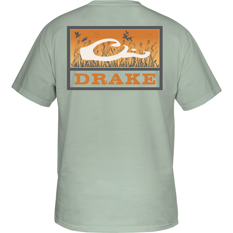 Marsh Flight T-Shirt featuring birds over a field, Drake logo on the back, crafted from soft, garment-washed 100% cotton for comfort.