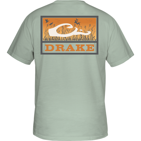 Marsh Flight T-Shirt featuring birds over a field, Drake logo on the back, crafted from soft, garment-washed 100% cotton for comfort.