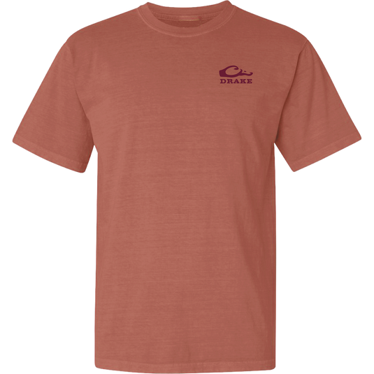 Don’t Let Em Behind You T-Shirt features a rust-colored design with a maroon wave logo and 'DRAKE' text on the chest, crafted from soft 100% cotton.