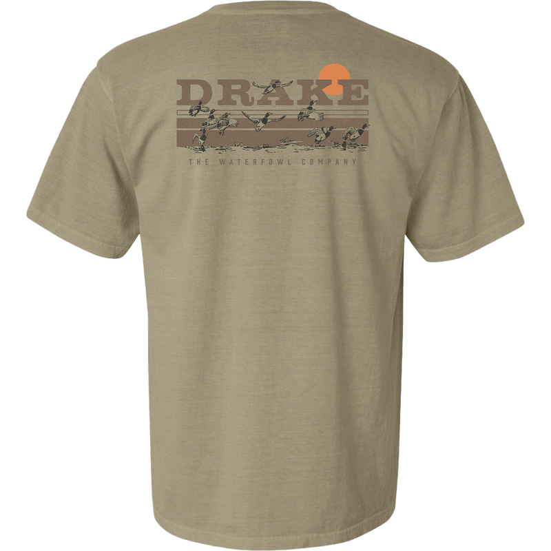 Back of the Take Flight T-Shirt featuring the Purewhitelaneshop logo, orange sun, and ducks in flight across a marsh, highlighting outdoor hunting themes.