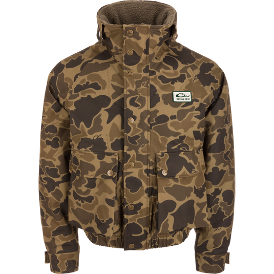 Throwback 80 Insulated Sport Bomber Jacket with camouflage pattern, high collar, snap-front, and “Drake” logo patch, featuring flap pockets and zoned insulation for warmth.