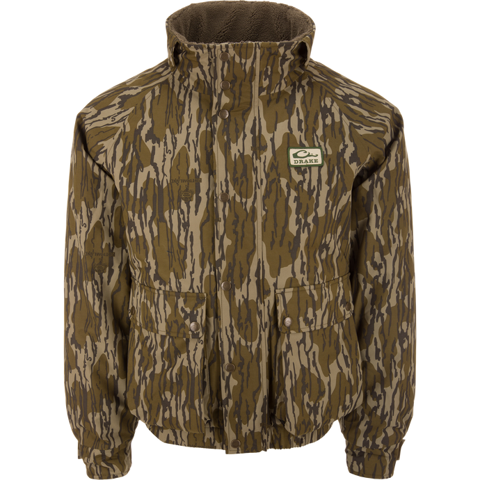 Throwback 80 Insulated Sport Bomber Jacket by Drake, featuring camo pattern, fleece-lined collar, snap-closure, and large pockets, displayed on a mannequin torso.
