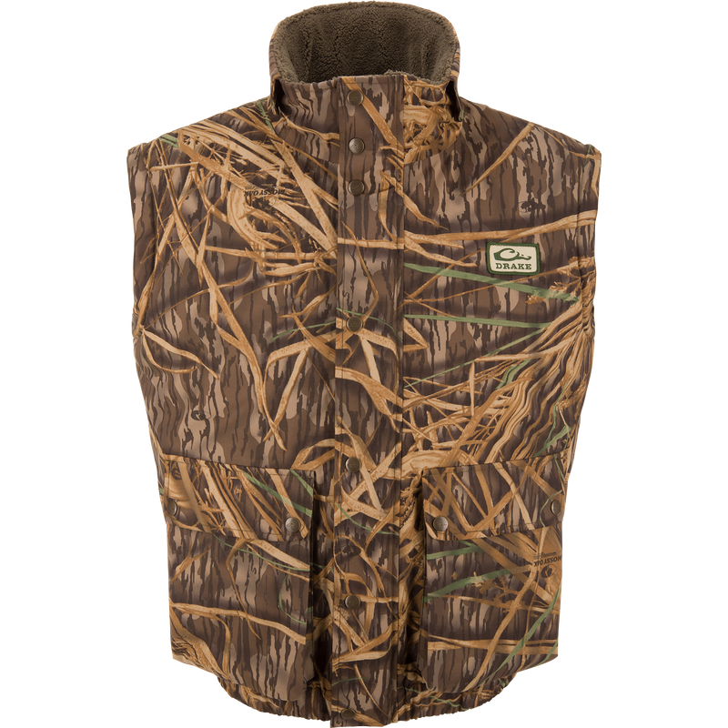 Drake's Throwback 80 Sport Vest, sleeveless camo with snap-front, features large pockets, high collar, and fleece lining for warmth, ideal for outdoor hunting adventures.