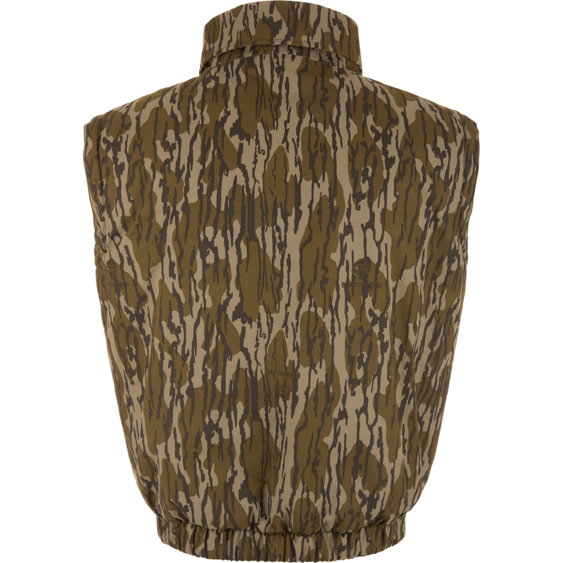 Throwback 80 Sport Vest from Purewhitelaneshop, featuring a camouflage pattern, stand-up collar, elastic waistband, and large accessory pockets, ideal for outdoor adventures.