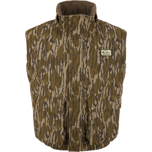 Throwback 80 Sport Vest: Sleeveless camouflage vest with high fleece collar, snap-front closures, large pockets, and Drake patch, designed for outdoor adventures.