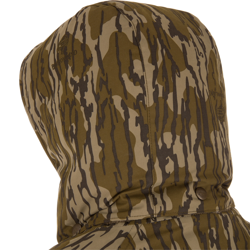 Throwback 80 Sport 3-in-1 Jacket hood, showcasing brown/olive camo pattern, snap button collar, and subtle branding, ideal for versatile outdoor adventures.