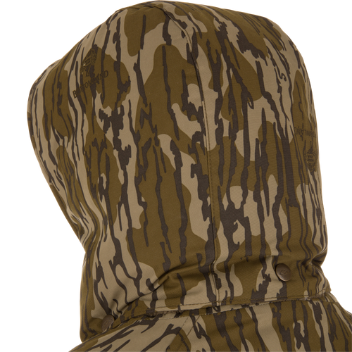 Throwback 80 Sport 3-in-1 Jacket hood, showcasing brown/olive camo pattern, snap button collar, and subtle branding, ideal for versatile outdoor adventures.