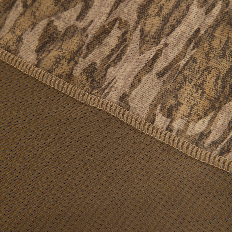 Close-up of the EST Offset 1.0 Half Zip Pullover, showing brown camouflage knit and perforated mesh fabric with overlock stitching for breathability and comfort.