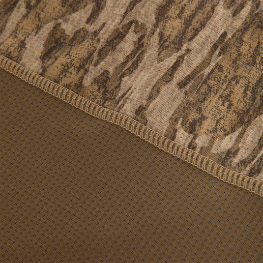 Close-up of the EST Offset 1.0 Half Zip Pullover, showing brown camouflage knit and perforated mesh fabric with overlock stitching for breathability and comfort.