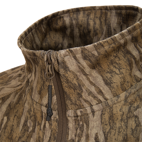 EST Offset 1.0 Half Zip Pullover features a high collar with central zipper, wood-grain camo print, ideal for hunting with ergonomic thumbholes for functionality.