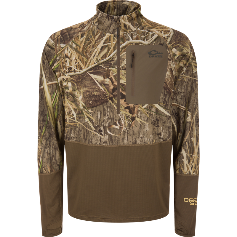 EST Offset 1.0 Half Zip Pullover in Mossy Oak Habitat camo with Drake logo, thumb-slot cuffs, and zippered chest pocket, designed for hunting concealment and comfort.