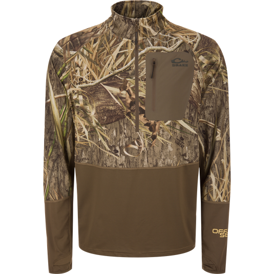 EST Offset 1.0 Half Zip Pullover in Mossy Oak Habitat camo with Drake logo, thumb-slot cuffs, and zippered chest pocket, designed for hunting concealment and comfort.