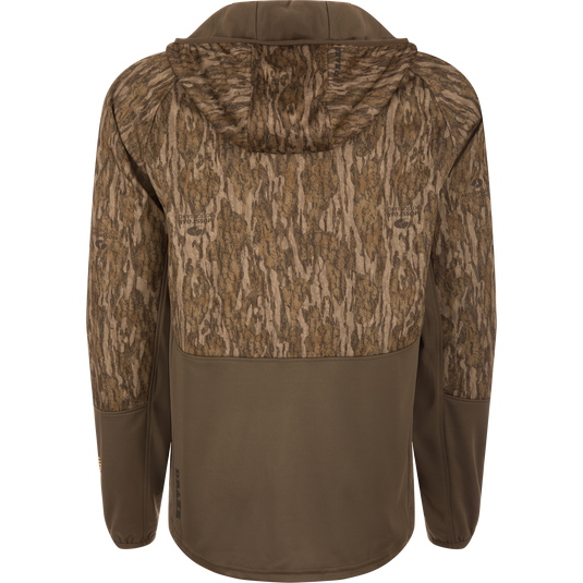 MST Offset 2.0 Half Zip Hoodie, featuring a Mossy Oak Bottomland camo upper and olive-brown lower, designed for comfort and functionality with multiple pockets.