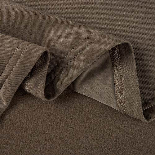 Close-up of MST Offset 2.0 Half Zip Hoodie fabric, showcasing its knit texture and soft brushed underside, exemplifying comfort and durability for outdoor adventures.