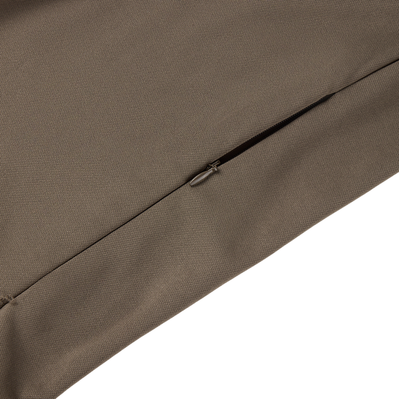 Close-up of the MST Offset 2.0 Half Zip Hoodie, showcasing a concealed zipper on khaki fabric, emphasizing its durable construction and ergonomic design.