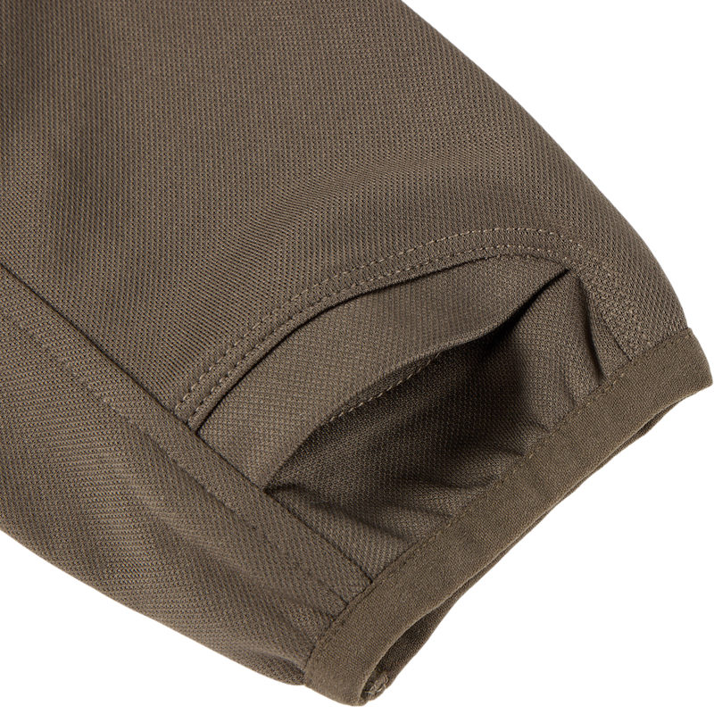 MST Offset 2.0 Half Zip Hoodie: Close-up of hem and curved pocket, showcasing durable, stretchy fabric ideal for outdoor adventures.