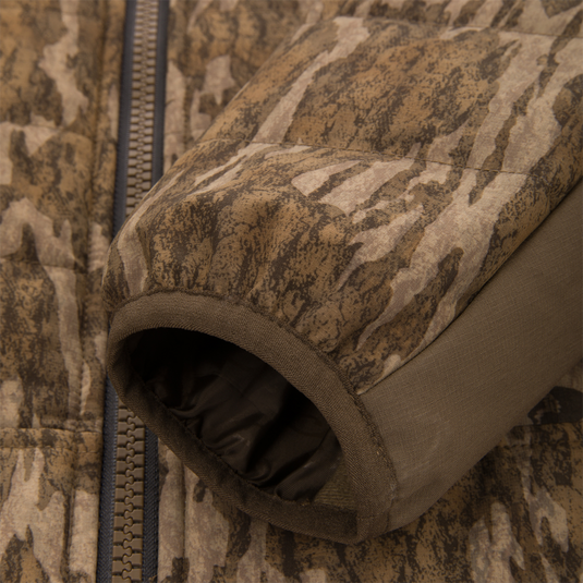 LST BMF Jacket with Primaloft, showcasing camo-patterned quilted fabric, YKK™ Vislon® zipper, and quick-adjust cuffs, ideal for variable hunting conditions.