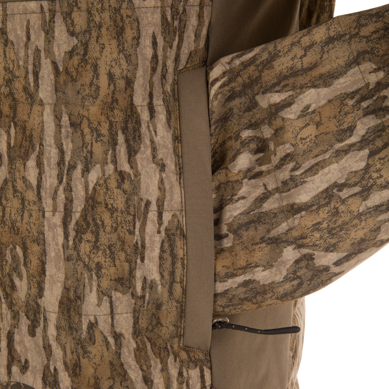 Close-up of LST BMF Jacket with Primaloft, showcasing camo-patterned fabric, zippered pocket, and seam, highlighting its durable, water-resistant, and insulated design for versatile, active use.
