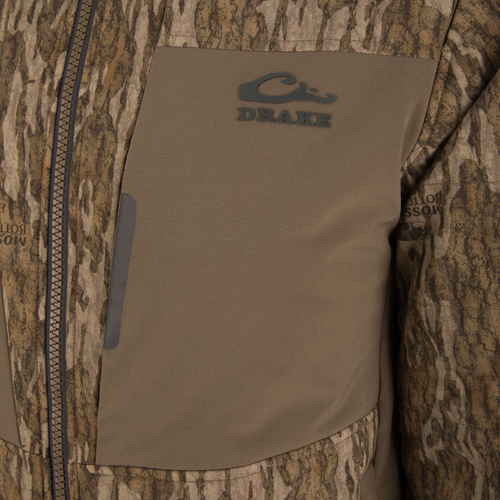 LST BMF Jacket with Primaloft features a camo pattern, Drake logo, and Mossy Oak print, showcasing a durable, water-resistant design with insulation and functional zippers.