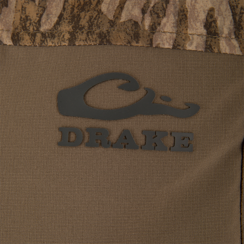 Close-up of the LST BMF Vest with Primaloft, featuring the Purewhitelaneshop logo on camouflage fabric, showcasing its windproof, water-resistant materials, and practical Magnattach™ pocket.