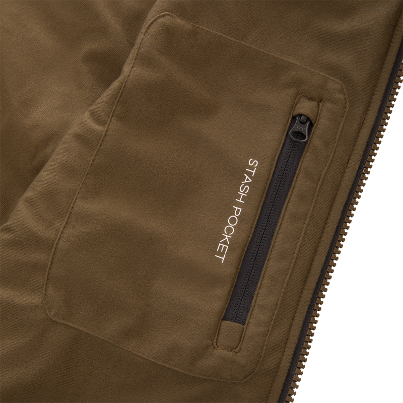 Close-up of the LST BMF Vest with Primaloft, highlighting the stash pocket with a black zip closure, emphasizing its functional design for versatile layering.